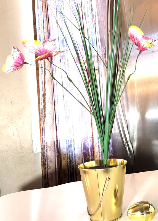 ONION GRASS PLANT IN GOLD POT - This hard-to-find 22" tall artificial onion grass plant in gold tone bucket pot will bring a whole new level of style to your space!